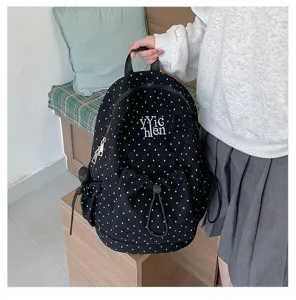 Black polka dot casual backpack, large capacity student school bag with front pocket.