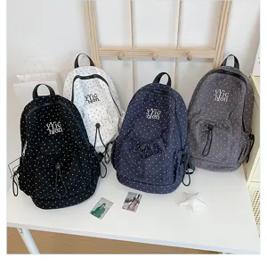 Casual polka dot backpack with large capacity, stylish school bag for daily student use.