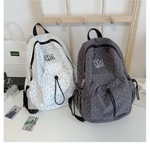 Casual canvas polka dot backpack for students, large capacity stylish daily school bag.