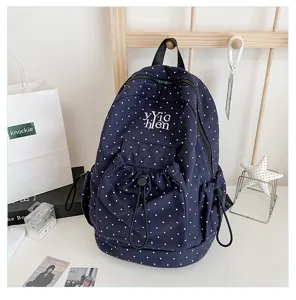 Casual polka dot canvas backpack with large capacity, trendy school bag for daily use.