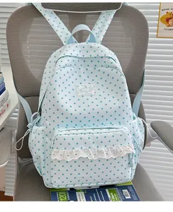 Light blue star pattern student backpack with white lace front pocket, cute Japanese style casual daypack.