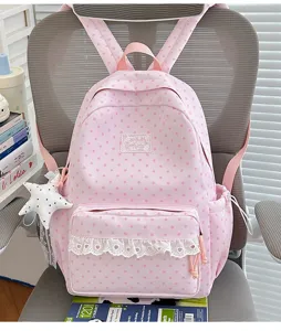 Cute pink Japanese style star pattern school backpack with white lace pocket and pendant.