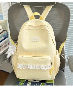 Yellow star print canvas backpack with cute white lace trim, ideal for daily school use.