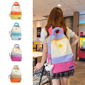 Korean style cute colorblock student backpack with lovely plush charm, large capacity.