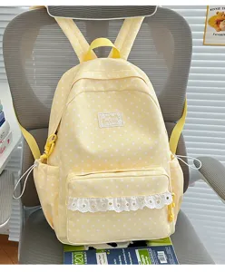 Cute yellow star print school backpack with sweet lace trim detail for daily student use.
