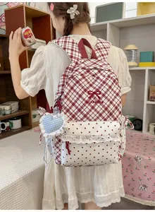 Japans stijl zoete ruitjes rugzak voor studenten met schattige strik en stip voorzak.