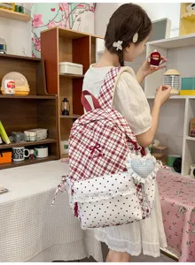Leuke Japanse stijl geruite schoolrugzak voor meisjes met stippen en strikdecoratie.