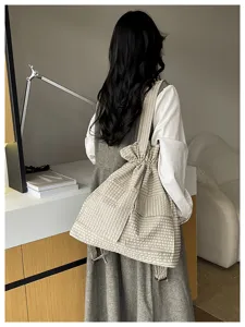 Casual plaid canvas drawstring backpack, stylish tooling travel dual-use shoulder bag.