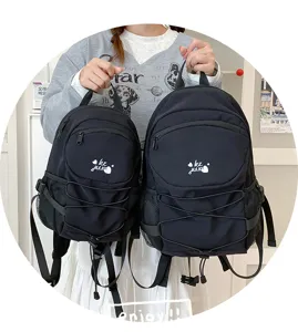 Detailed shot of casual black twin backpacks showcasing large capacity and trendy campus style.