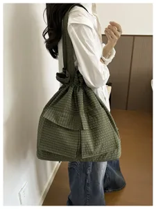 Casual green plaid shoulder bag with drawstring closure, spacious tote for daily travel.