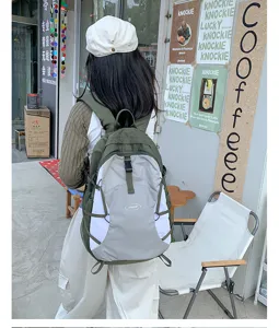 Detail view of the lightweight outdoor hiking backpack with contrast color straps and secure buckles.