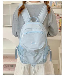 Detail view of the lightweight casual campus backpack featuring drawstring and mesh side pockets.
