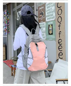 Casual outdoor travel backpack with multi-color splicing design for daily hiking and sports.