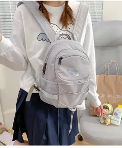 Casual grey school backpack for women, multi-pocket design with cute embroidery style.