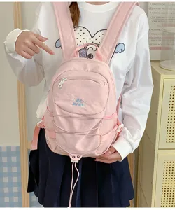 Pink mini backpack for women, cute casual daypack with drawstring and front pocket, stylish school