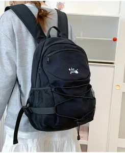 Detail view of stylish black casual backpack with large capacity and convenient drawstring design.