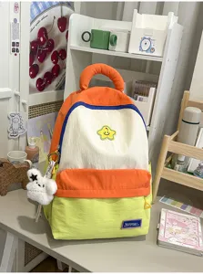Cute Korean style student schoolbag, vibrant color block large capacity backpack with cute charm.