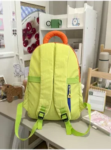 Detailed view of the Korean style color-blocking student backpack in bright green and orange.