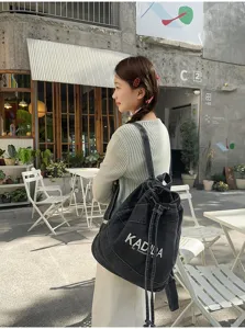 Vintage washed denim backpack for women, casual large capacity school and travel rucksack.