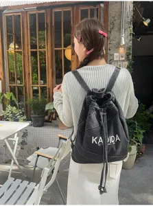 Vintage washed denim backpack for women, large capacity casual student school bag.
