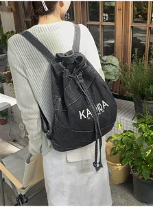 Vintage washed denim backpack, large capacity casual school bag for daily commuting and student use.