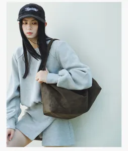 Casual vintage brown suede shoulder bag detail, stylish slouchy hobo bag for women daily wear.