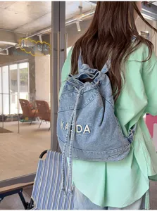 Vintage washed denim backpack, large capacity student casual commuter school bag.