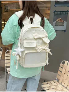 Mochila ita blanca informal con lazos y ventana transparente, gran capacidad escolar.