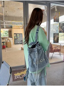 Vintage washed denim backpack for women, Korean style casual large capacity school bag.