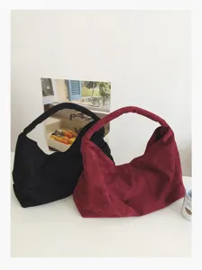 Detailed view of casual slouchy hobo underarm shoulder bag, soft suede texture, daily purse.
