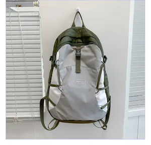 Lightweight color-blocked hiking backpack with buckle straps and side mesh pockets for outdoor.