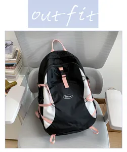 Casual black and white backpack with pink straps, large capacity stylish school bag for travel.