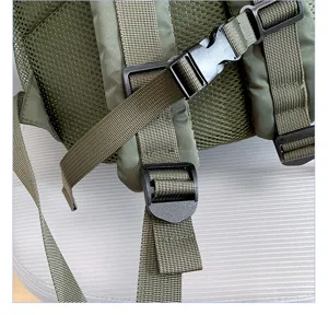 Backpack strap detail showing adjustable nylon webbing, durable plastic buckles and breathable mesh.