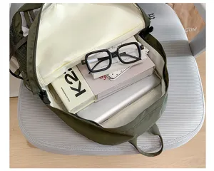 Detailed view of the large capacity green backpack showing spacious interior storage.