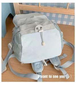 INS style drawstring large capacity backpack with mesh side pockets for daily casual school use.