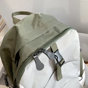 Lightweight waterproof backpack for outdoor hiking and travel, durable nylon grey green daypack.