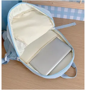Detailed view of light blue laptop backpack interior, large capacity school book bag.