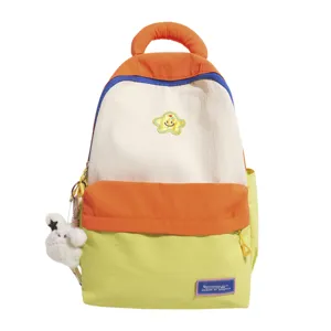Colorful colorblock school backpack for women with cute star patch and plush pendant.