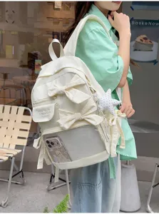 Mochila ita blanca para mujer con bolsillo frontal transparente, lazos bonitos y gran capacidad.