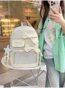 Mochila ita blanca con lazos y ventana transparente, elegante bolso escolar diario.