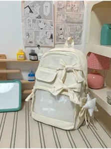 Mochila escolar beige de gran capacidad con lazos bonitos y ventana transparente uso diario.