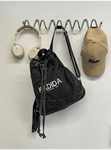 Vintage washed denim backpack for women, large capacity student commuter casual daypack.