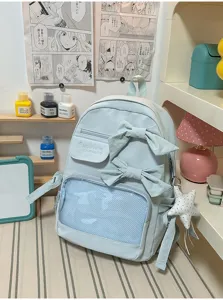 Mochila ita azul claro con lazos y bolsillo de malla transparente para estudiantes