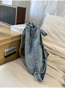 Korean vintage washed denim backpack with large capacity, ideal for students and daily commute.