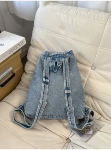 Vintage washed denim backpack for women, casual large capacity school bag, vintage design.