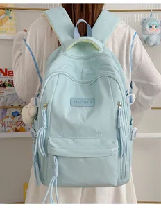 Leuke lichtblauwe schoolrugzak voor meisjes met strikjes borduurwerk, grote capaciteit.