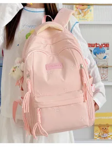 Leuke roze schoolrugzak met strik borduurwerk, grote capaciteit voor meisjes en dames.