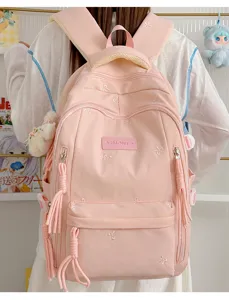 Roze schoolrugzak met leuke strik borduursels, grote capaciteit voor schoolmeisjes detail.