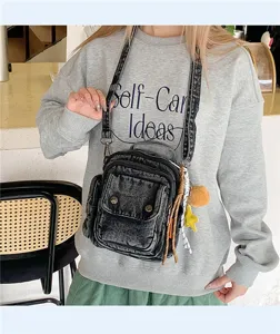 Detailed showcase of the trendy denim crossbody bag, casual multi-pocket design for daily wear.