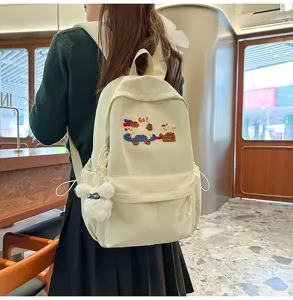 Casual canvas backpack for women, cute dog design, lightweight and spacious school bag.
